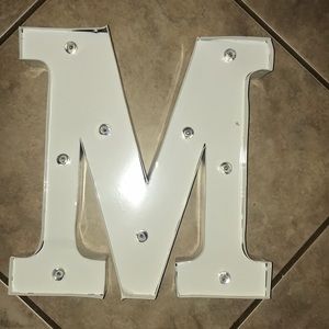 Lighted letter M